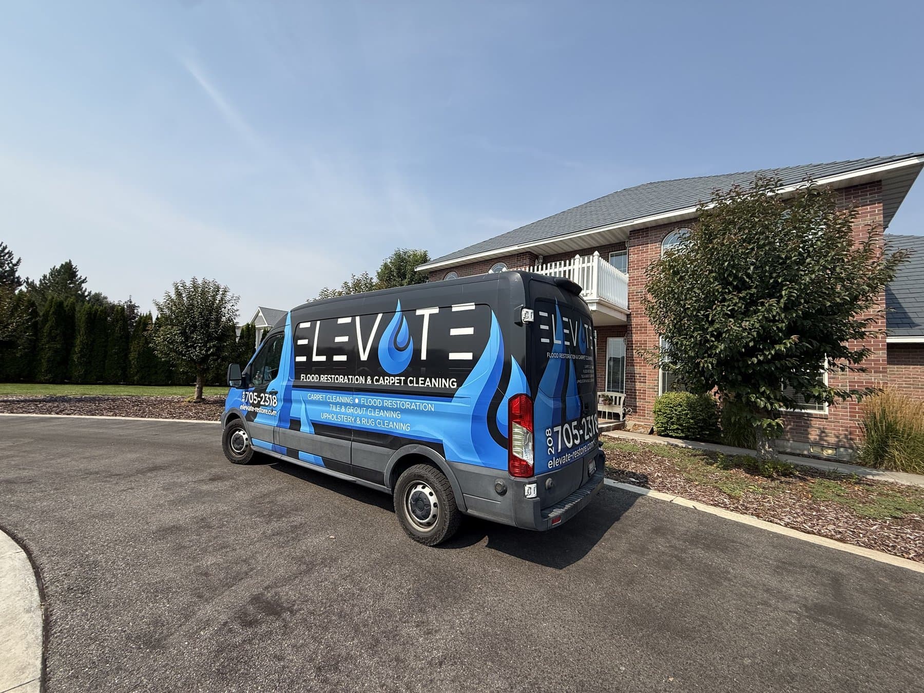 Elevate service van parked outside a home in Idaho Falls, ID